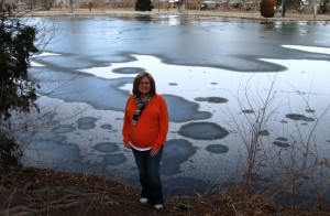 Kathy showing off that great tummy in front of a semi-frozen pond