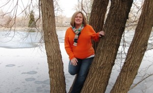 Kathy showing off that great tummy in front of a semi-frozen pond