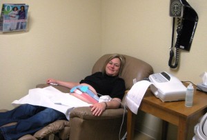 Kathy relaxing in the Dr's office as they run charts on baby's heart rate and contractions.   Both were perfect.