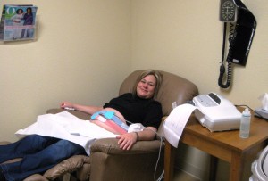 090303doctorpost-2 Kathy relaxing in the Dr's office as they run charts on baby's heart rate and contractions. Both were perfect.