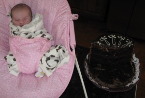 Grace's first birthday cake; 1week old! ...uhh, and already some cake missing