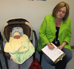 This is funny!  A few minutes before the appoinment, Mom starts some paperwork but soon Grace and Mom nod off for a moment.   Grace's first few days here on planet earth make everyone a bit tired!!
